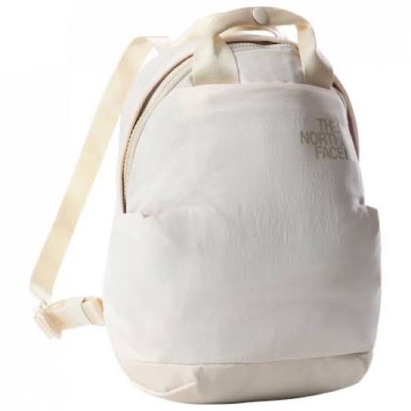 The North Face Handbags - The North Face Never Stop Mini in ivory like new women’s backpack